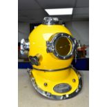 A REPRODUCTION US NAVY DIVING HELMET, for decorative purposes, bright yellow orange finish, plaque