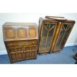 AN ART DECO OAK BOOKCASE, the two glazed doors enclosing two glass shelves, width 97cm x depth