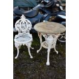 A HEAVY PAINTED CAST IRON PUB TABLE, with a wooden top, diameter 58cm x height 70cm (condition:-