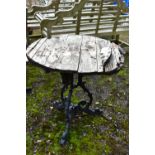 A CAST ALUMINIUM GARDEN TABLE, diameter 70cm x height 71cm (condition:-wooden top distressed and