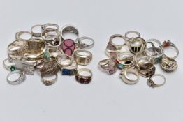 AN ASSORTMENT OF WHITE METAL RINGS, forty-three rings in total, of various designs, some with