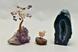 THREE MINERAL SPECIMEMS, the first an amethyst geode, fashioned with a yellow metal wire tree