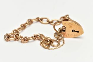 A 9CT GOLD BRACELET, oval link chain fitted with a spring clasp, fitted with a heart padlock clasp