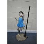 A VINTAGE STANDARD LAMP, of a girl skipping, height of lamp 138cm x height of girl 116cm (