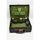 A GEORGE V BLACK LEATHER DRESSING CASE, green fabric lined interior with brown leather trim, the