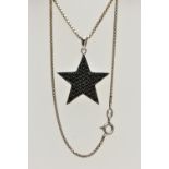 A WHITE METAL BLACK CUBIC ZIRCONIA SET PENDANT NECKLACE, the star pendant pave set with circular cut
