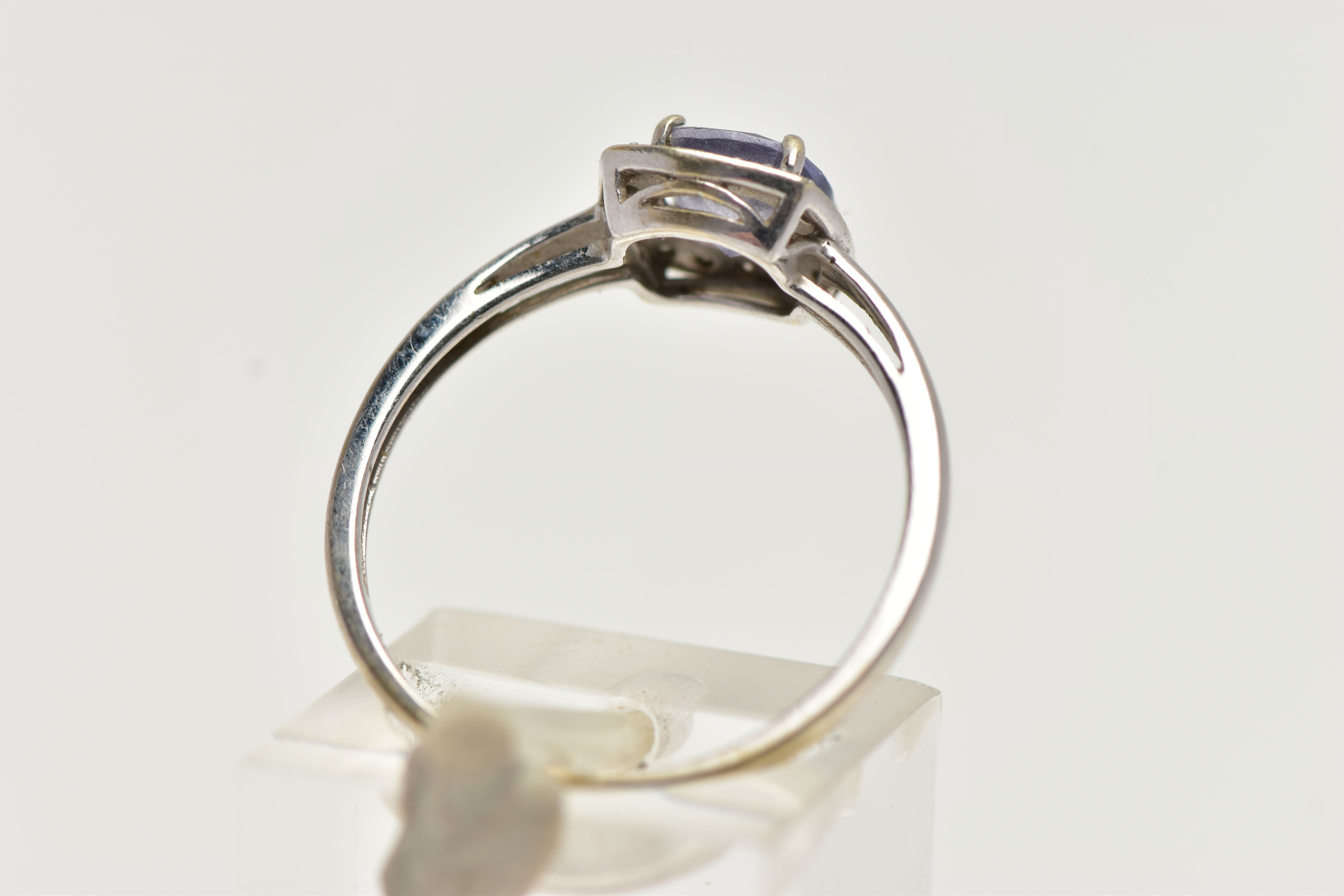 A WHITE METAL IOLITE AND DIAMOND CLUSTER RING, designed with a square cut iolite within a surround - Image 3 of 4