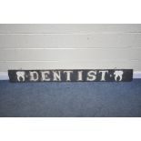 A 19TH CENTURY WOODEN BOARD, LATER PAINTED AS A 'DENTIST' SIGN, with applied wooden tooth to
