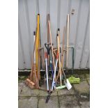 A COLLECTION OF GARDEN TOOLS to include spades, brushes, forks, loppers etc