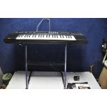 A CASIOTONE CT-450 ELECTRIC KEYBOARD with stand and some music books (PAT pass and working) (