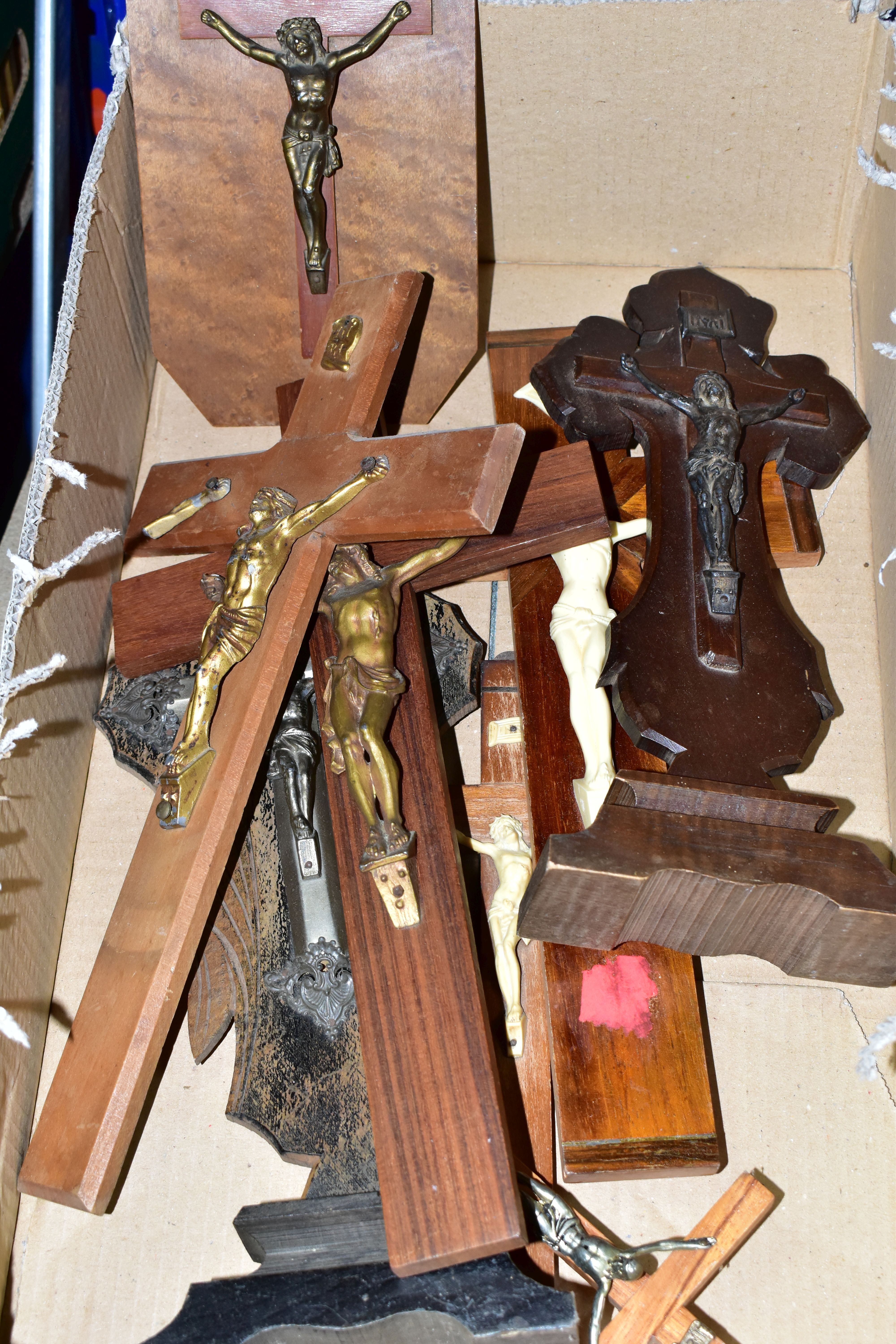 A BOX OF EIGHT CRUCIFIXES, to include two freestanding examples, one mounted to an octagonal