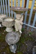 A WEATHERED COMPOSITE FIGURAL BIRD BATH, circular top, on a loose base depicting a putto, diameter