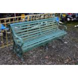 A GREEN PAINTED STRAPWORK IRON BENCH, with scrolled arms and supports, length 184cm (condition:-