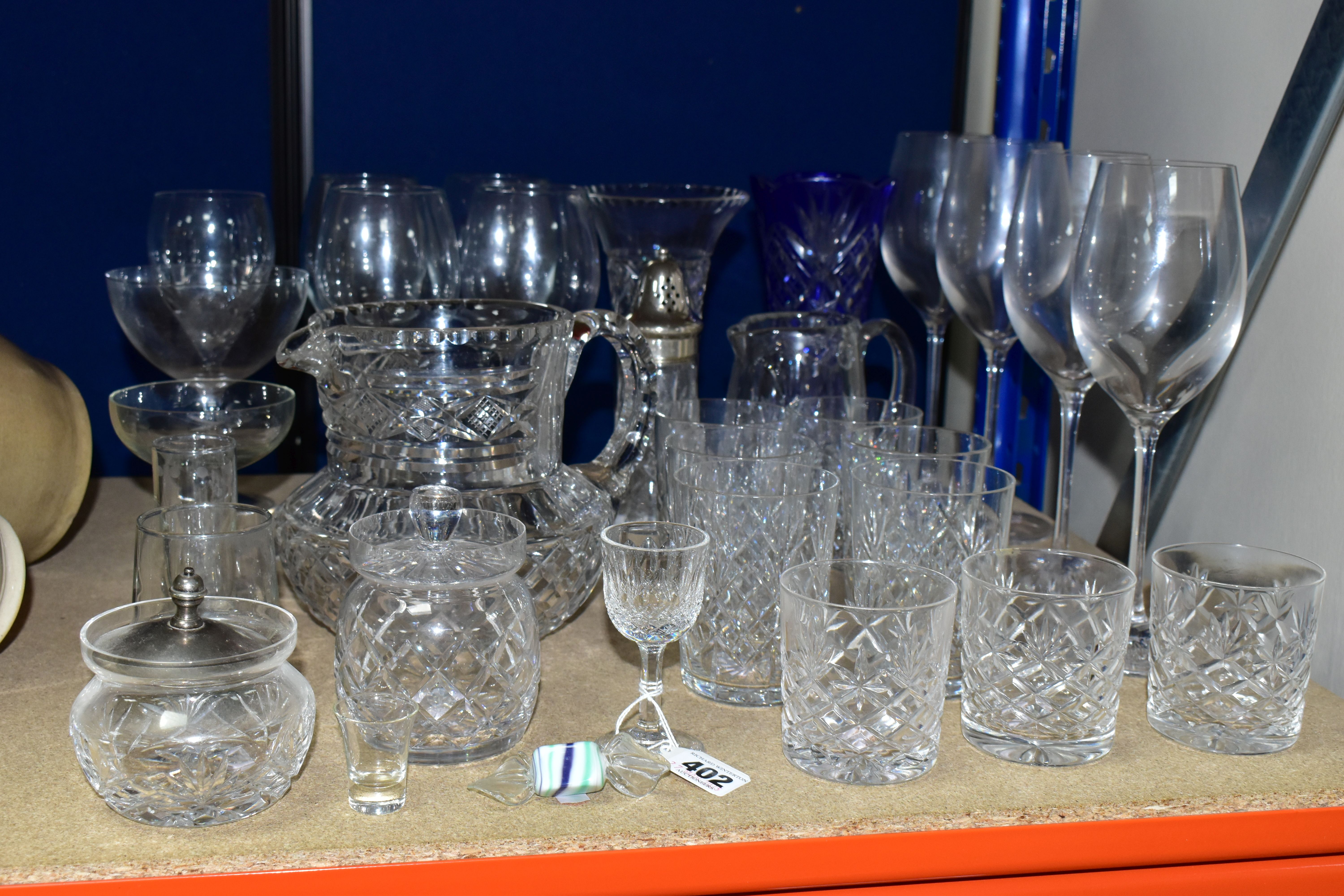 A GROUP OF CUT CRYSTAL AND OTHER GLASSWARES, over thirty pieces to include a set of four Waterford