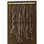 A TRAY OF WHITE METAL CHAINS, twelve chains in total of various styles, all fitted with spring