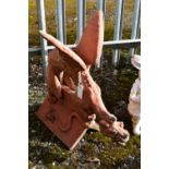A TERRACOTTA FIGURAL ROOF TILE, of a mythical winged creature (condition:-no apparent cracks)