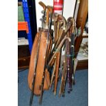 A LARGE QUANTITY OF WALKING STICKS AND A SET VINTAGE GOLF CLUBS, to include a set of Dunlop '