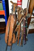 A LARGE QUANTITY OF WALKING STICKS AND A SET VINTAGE GOLF CLUBS, to include a set of Dunlop '