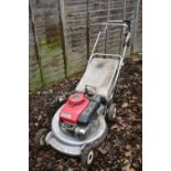 A HONDA HR21 5 PETROL SELF PROPELLED LAWN MOWER, with 52.5cm cutting width and grass box (engine