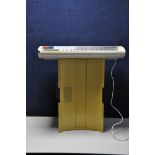 A 1960s BONTEMPI POP3 ELECTRONIC KEYBOARD in mustard and white, space ship design with top and