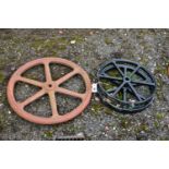 A CAST IRON MACHINE PULL WHEEL, diameter 63cm, along with a pair of black painted kart wheels,