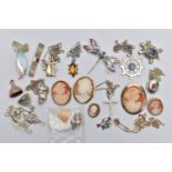 A BAG OF ASSORTED WHITE METAL JEWELLERY, to include six cameo brooches, a white metal shell detailed