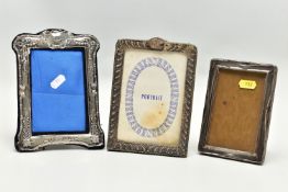 THREE EARLY 20TH CENTURY SILVER MOUNTED EASEL BACK PHOTOGRAPH FRAMES, of rectangular form, all