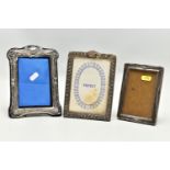 THREE EARLY 20TH CENTURY SILVER MOUNTED EASEL BACK PHOTOGRAPH FRAMES, of rectangular form, all