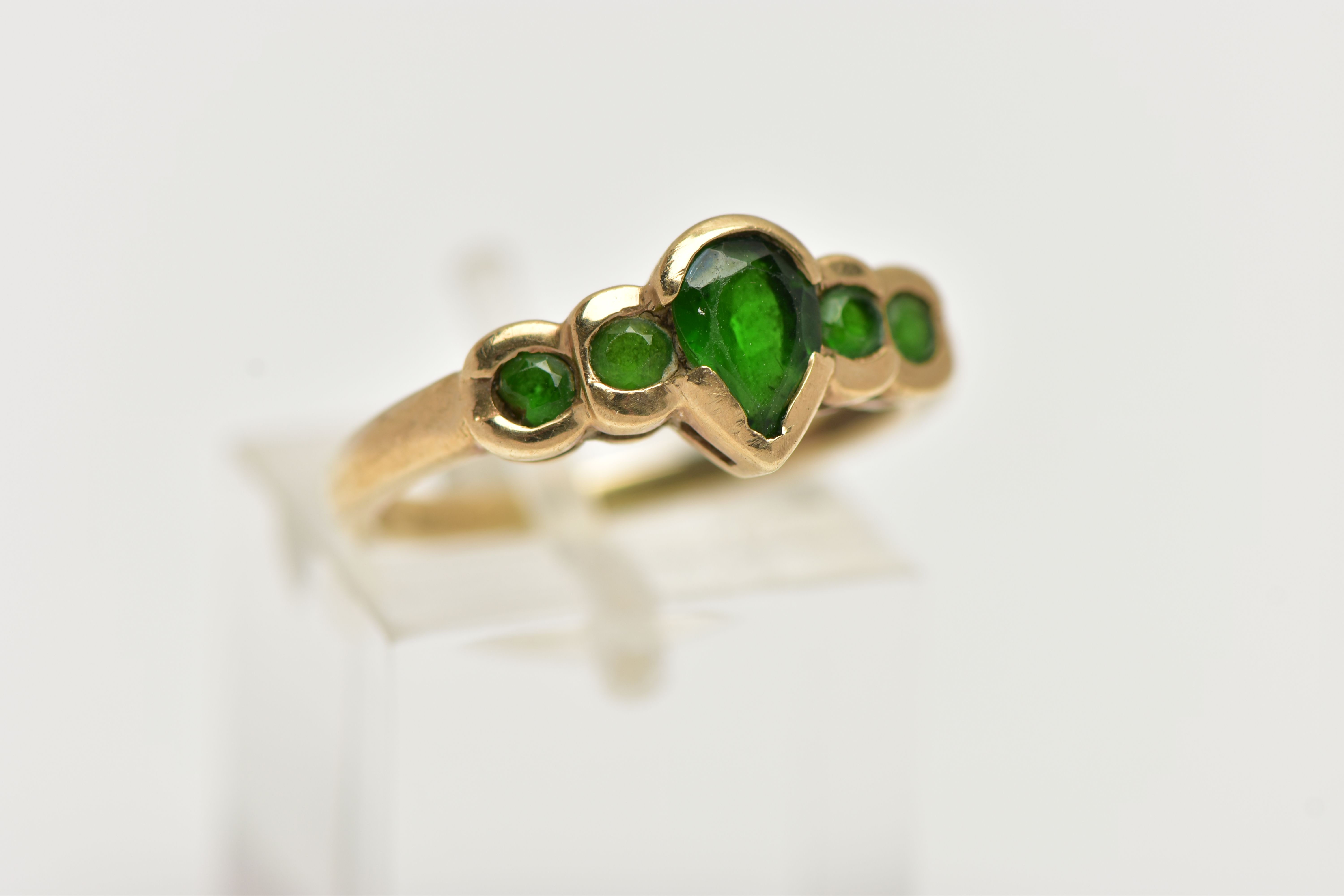 A 9CT GOLD CHROME DIOPSIDE RING, designed with a central pear cut stone flanked with four smaller - Image 4 of 4