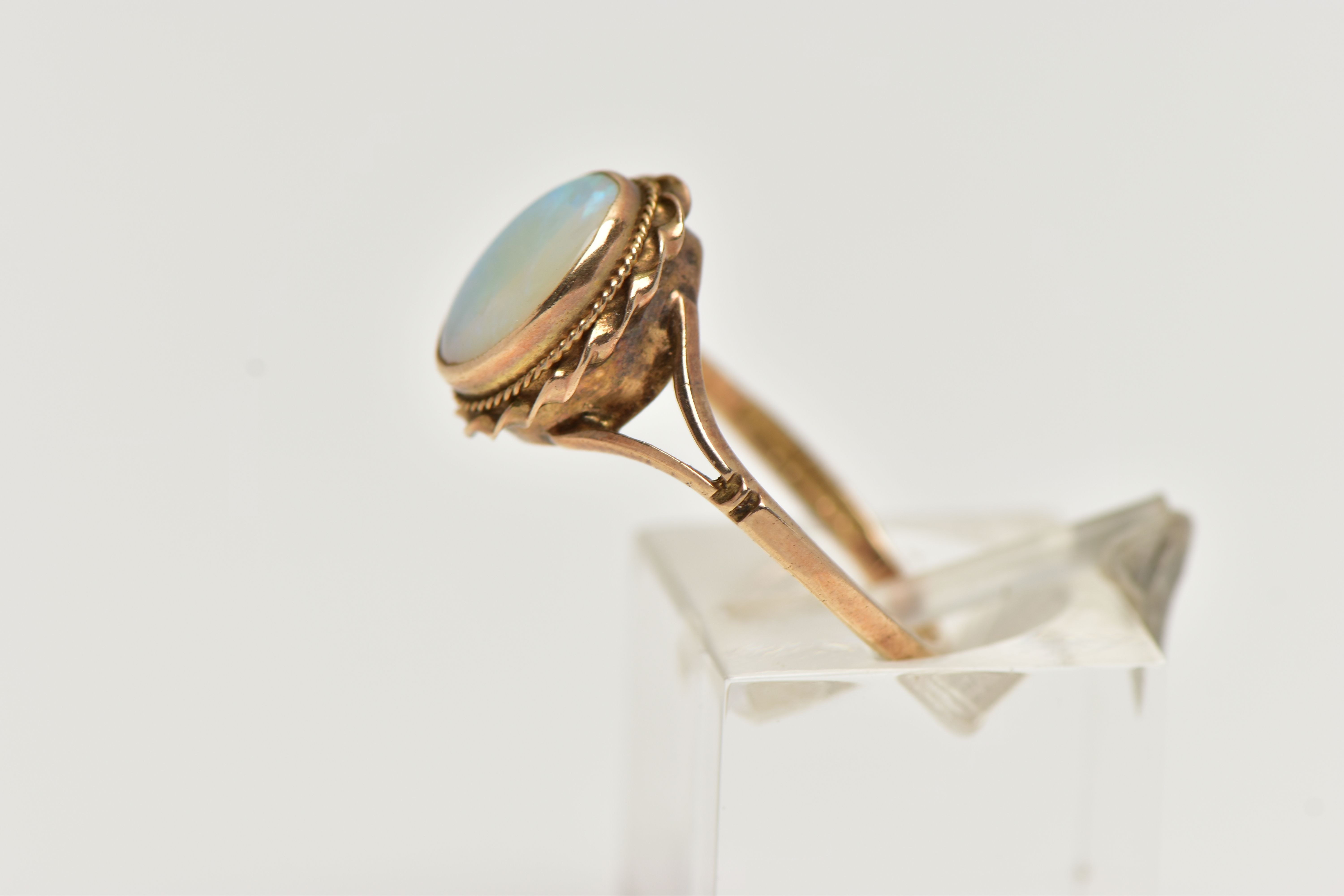 A 9CT GOLD OPAL RING, designed with an opal cabochon, in a milgrain collet setting, to a rope - Image 2 of 4