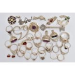 AN ASSORTMENT OF WHITE METAL JEWELLERY, to include three white metal fobs, an assortment of rings,