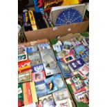 THREE BOXES OF PUZZLES AND GAMES containing a very large collection of playing cards from around the