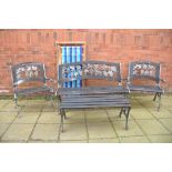 A FOUR PIECE CAST METAL AND SLATTED GARDEN SUITE, comprising a garden bench, two matching armchairs,