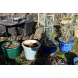 FOUR VARIOUS GLAZED PLANTERS, of the similar size nut differed colours, largest size diameter 52cm x