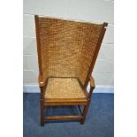 AN EARLY TO MID 20TH CENTURY OAK AND RUSH BACK ORKNEY CHAIR, with open armrests, width 55cm x