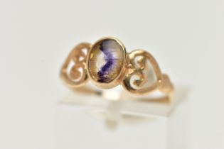 A 9CT GOLD BLUE JOHN FLUORITE RING, designed with an oval blue john fluorite cabochon, collet set,