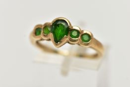 A 9CT GOLD CHROME DIOPSIDE RING, designed with a central pear cut stone flanked with four smaller