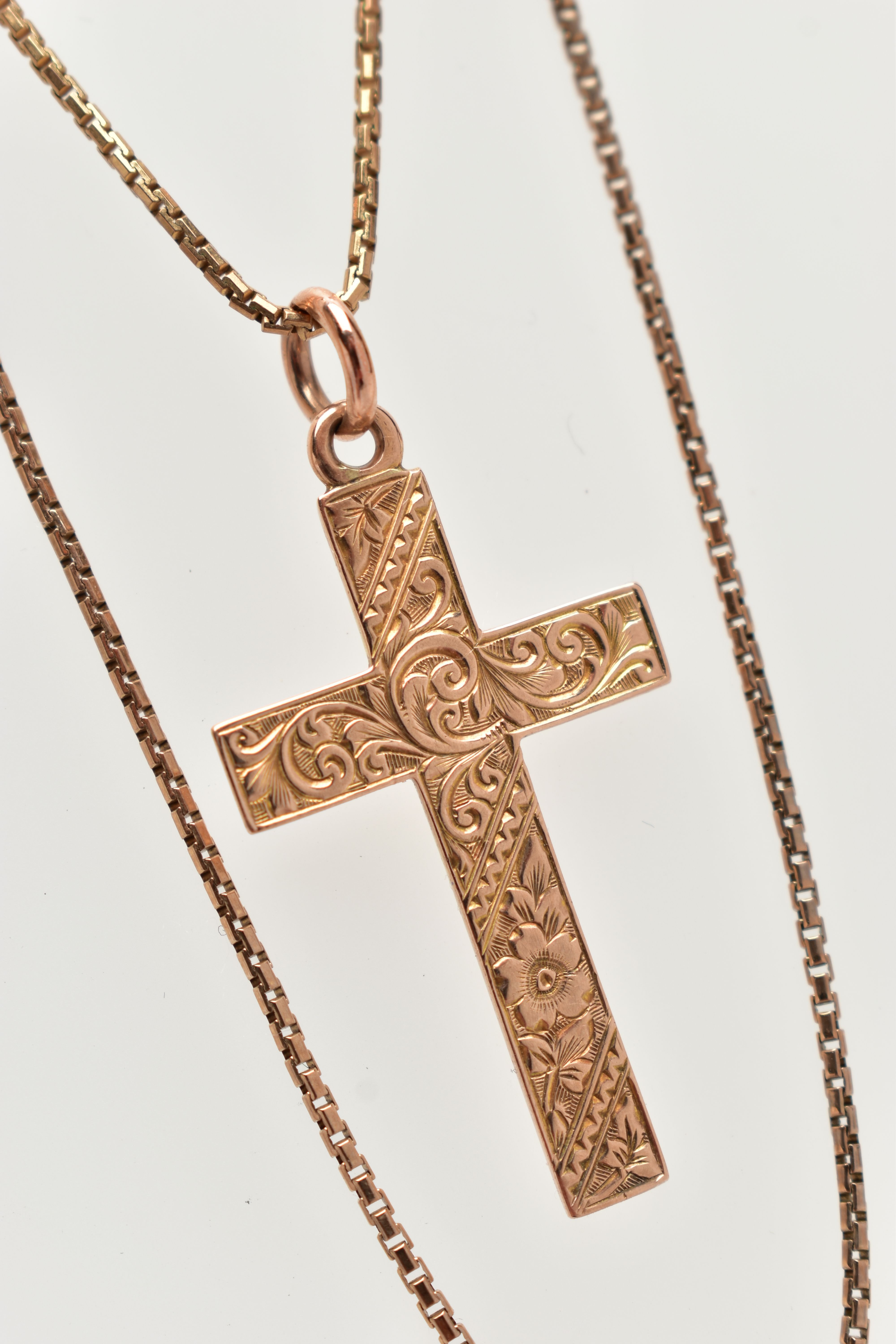 A 9CT GOLD PENDANT AND CHAIN, a rose gold cross pendant with floral and foliage engraved detail, - Image 2 of 3