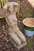 A WEATHERED COMPOSITE GARDEN FIGURE OF A NUDE LADY KNEELING, height 96cm