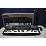 A YAMAHA PSR-47 ELECTRIC KEYBOARD in original box with stand (PAT pass and working)