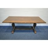 A REPRODUCTION OAK REFECTORY TABLE, on twin acorn legs, united by a floor stretcher, length 199cm