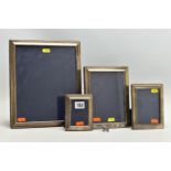 A SET OF FOUR ELIZABETH II SILVER MOUNTED EASEL BACK PHOTOGRAPH FRAMES OF RECTANGULAR FORM, with a