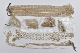 AN ASSORTMENT OF SILVER AND WHITE METAL CHAINS, the first a silver fancy link chain, hallmarked