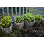 A PAIR OF WEATHERED COMPOSITE PLANTERS, with lattice detail to the sides, diameter 34cm x height