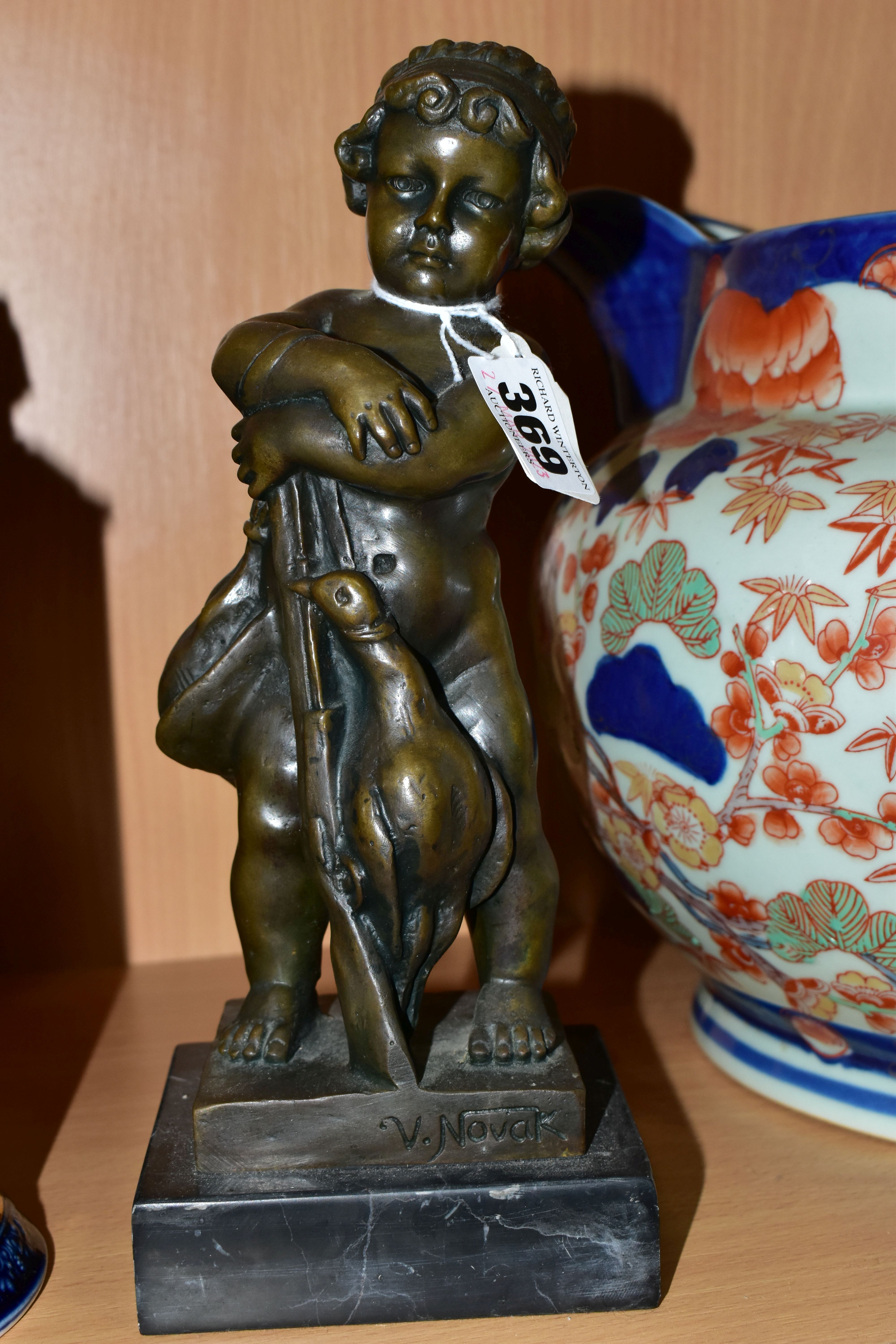 A BRONZE FIGURE AND A GROUP OF CERAMICS, comprising a bronze figure of a boy with a gun and two - Image 6 of 7