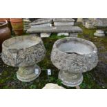 A PAIR OF WEATHERED COMPOSITE PLANTERS, on separate bases, diameter 45cm x height 45cm (condition:-