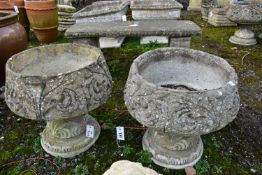 A PAIR OF WEATHERED COMPOSITE PLANTERS, on separate bases, diameter 45cm x height 45cm (condition:-