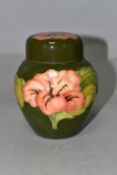 A MOORCROFT POTTERY SMALL GINGER JAR AND COVER, in the Coral Hibiscus pattern on a green ground,