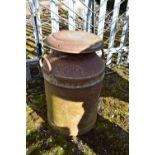 A RUSTED ALUMINIUM MILK CHURN