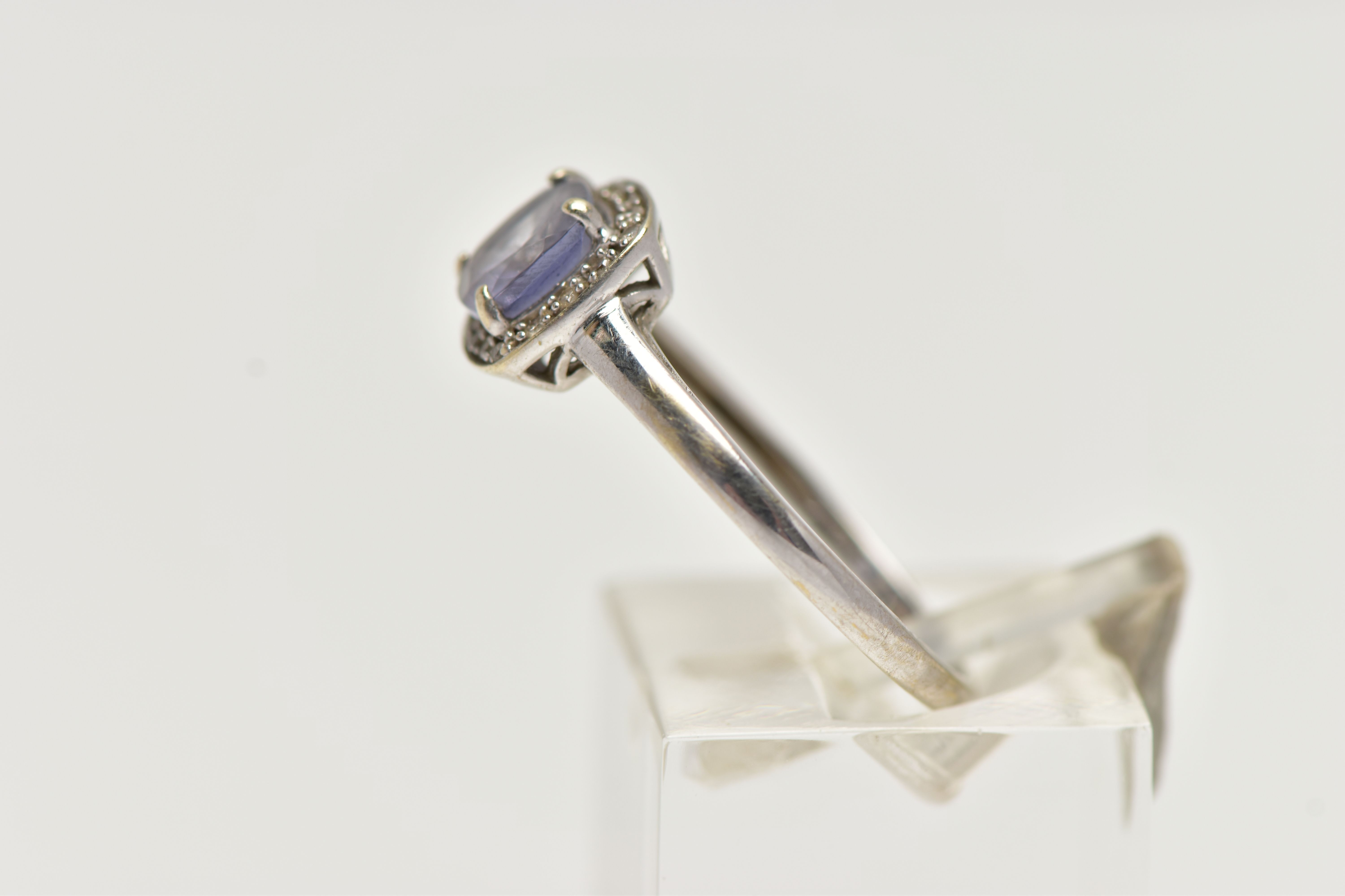 A WHITE METAL IOLITE AND DIAMOND CLUSTER RING, designed with a square cut iolite within a surround - Image 2 of 4